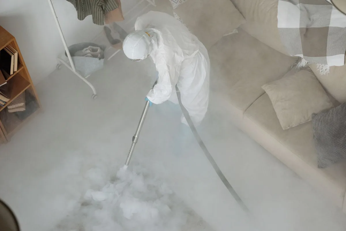 Biohazard cleanup technician in protective equipment, Terrell Hills, TX